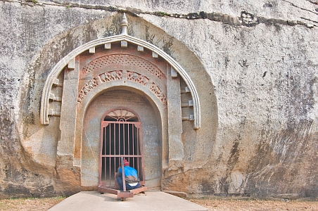 Unlocking gate to the Lomas Rishi Cave - Click to show bigger image in new browser