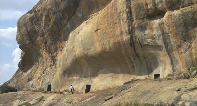 Dr Aziz Runs Along The Line Of Cave Entrances - Click to show full-size image in new browser