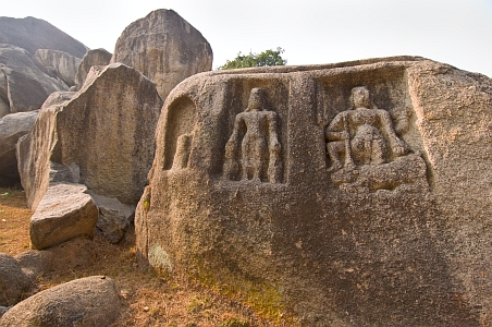 Hindu deities carved on side of a large boulder - Click to show bigger image in new browser