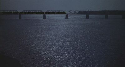 Train crossing bridge over a river - Click to show full-size image in new browser